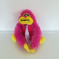 Tépőzáras kezű pink plüss majom nyakkendőben