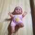 Munecas Arias csecsemő baba rózsaszín ruhában