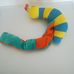 Early Years zenélő készségfejlesztő plüss csiga