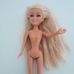 Hosszú szőke hajú zöld szemű Barbie jellegű baba