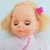 Szőke hajú puha testű kislány baba rózsaszín rugdalózóban