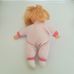 Szőke hajú puha testű kislány baba rózsaszín rugdalózóban