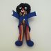 Golliwog kék frakkos csíkos nadrágos néger figura